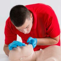 A Trainer Demonstrating First Aid & CPR